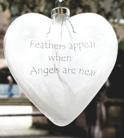 Feathers appear when angels are near hanging heart